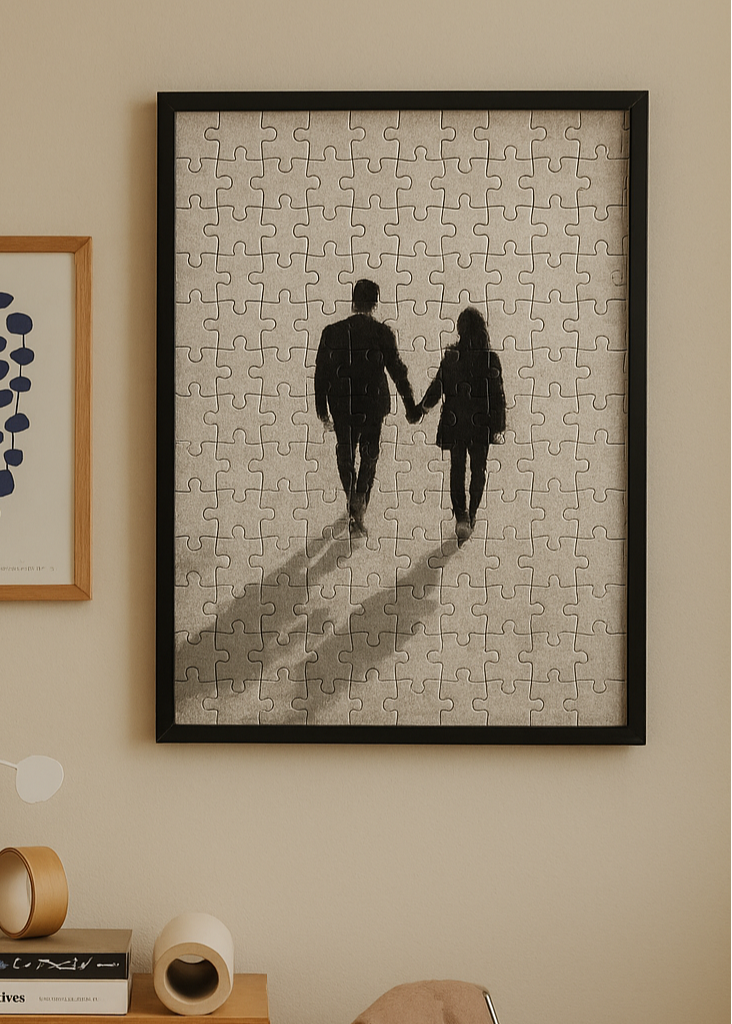 Custom wooden photo puzzle with black frame hanging on wall – personalized couple gift by Nexura.